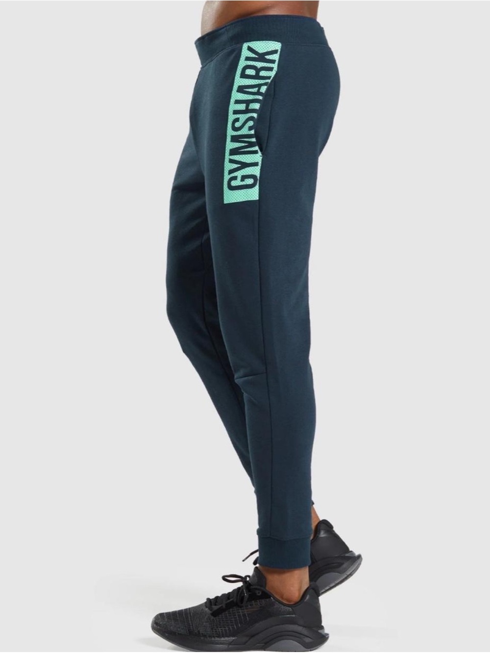 Gymshark Men’s Navy Joggers with Teal Logo Panel
